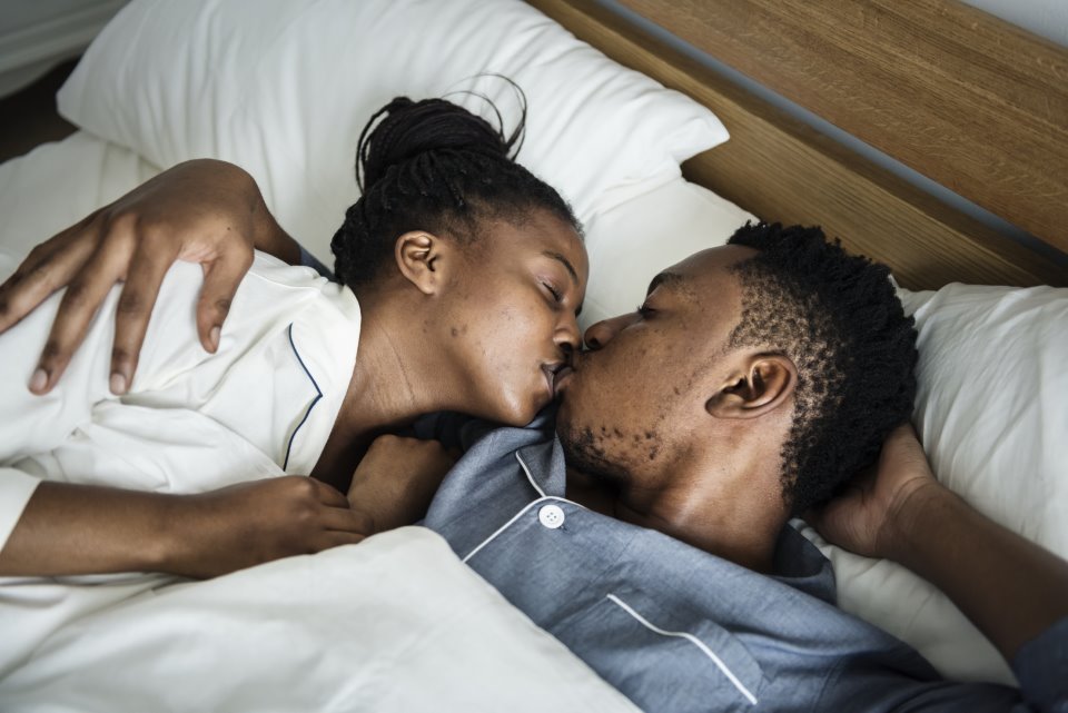 A black man and woman having natural insemination