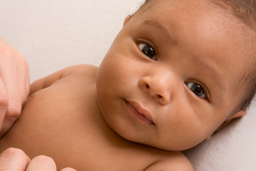 Mixed race baby with eyes open