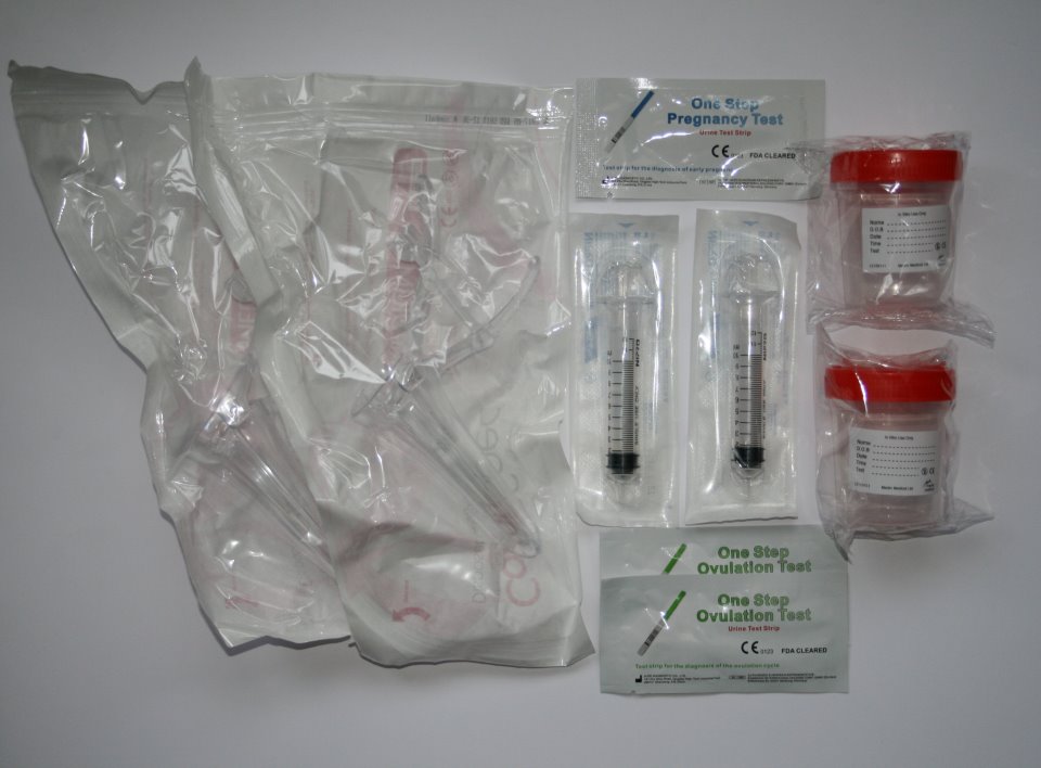 Starter home insemination kit featuring 2 speculums, 2 specimen cups, 2 syringes, 2 ovulation tests and 1 pregnancy test